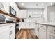 Bright kitchen featuring quartz counters, white cabinetry, stainless appliances and modern subway tile backsplash at 582 Mclernon Trce, Johns Island, SC 29455