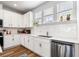 A view of the kitchen with white cabinetry, stainless appliances, light counter tops and modern backsplash at 582 Mclernon Trce, Johns Island, SC 29455