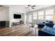 Inviting living room with hardwood floors, plenty of natural light, and stylish furnishings at 582 Mclernon Trce, Johns Island, SC 29455
