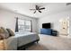 Comfortable main bedroom includes plush carpet, a window, and access to a bathroom at 582 Mclernon Trce, Johns Island, SC 29455