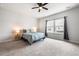 Serene main bedroom featuring a ceiling fan, plush carpet, and a bright window at 582 Mclernon Trce, Johns Island, SC 29455