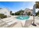Community pool surrounded by lounge chairs and palm trees is perfect for relaxing and enjoying the sun at 582 Mclernon Trce, Johns Island, SC 29455