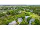 Aerial view of houses surrounded by lush greenery and a golf course at 5847 Back Bay Dr, Isle of Palms, SC 29451