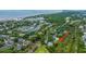 Coastal aerial view of residential area, with tennis courts, homes, marsh and beaches at 5847 Back Bay Dr, Isle of Palms, SC 29451