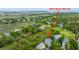 Aerial view of a home, golf course, and marshland; prime real estate nestled in nature at 5847 Back Bay Dr, Isle of Palms, SC 29451