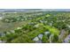 Aerial view of the golf course community surrounded by homes, marshland and a winding river at 5847 Back Bay Dr, Isle of Palms, SC 29451