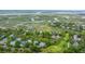 Wide aerial shot featuring homes, marshland and golf course in coastal golf community at 5847 Back Bay Dr, Isle of Palms, SC 29451