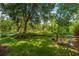 Scenic backyard with lush lawn and greenery, offering a peaceful outdoor space at 5847 Back Bay Dr, Isle of Palms, SC 29451