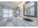 Bathroom features double black sinks, tiled countertop, and floral wallpaper at 5847 Back Bay Dr, Isle of Palms, SC 29451