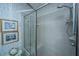 Modern shower with glass doors and tile walls at 5847 Back Bay Dr, Isle of Palms, SC 29451