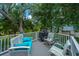 Outdoor deck features patio furniture and a grill, ideal for relaxing and enjoying the outdoors at 5847 Back Bay Dr, Isle of Palms, SC 29451