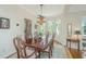 Formal dining room featuring hardwood floors, chandelier, and lots of natural light at 5847 Back Bay Dr, Isle of Palms, SC 29451
