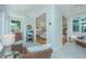 Cozy sunroom showcasing natural light, comfortable furniture, and seamless flow into adjacent spaces at 5847 Back Bay Dr, Isle of Palms, SC 29451