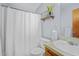 Clean bathroom with a shower, toilet, and vanity with a decorative mirror and towel rack at 6231 Rolling Fork Rd # 1201-A, North Charleston, SC 29406