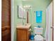 Bathroom featuring matching blue decor, wood cabinet and a mirrored vanity at 6231 Rolling Fork Rd # 1201-A, North Charleston, SC 29406