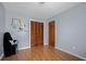 Simple bedroom with wood-look flooring, wood doors, and a calm, neutral color scheme at 6231 Rolling Fork Rd # 1201-A, North Charleston, SC 29406