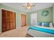 Bedroom featuring light green walls, two closets and a ceiling fan at 6231 Rolling Fork Rd # 1201-A, North Charleston, SC 29406