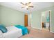 Bedroom with light green walls, ceiling fan and en-suite bathroom at 6231 Rolling Fork Rd # 1201-A, North Charleston, SC 29406