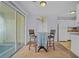 Dining area adjacent to kitchen and screened porch at 6231 Rolling Fork Rd # 1201-A, North Charleston, SC 29406