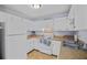 Well-lit kitchen with white cabinets, laminate countertops, and essential appliances at 6231 Rolling Fork Rd # 1201-A, North Charleston, SC 29406
