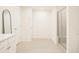 Modern bathroom featuring a glass-enclosed shower, tiled floors, and sleek vanity with ample storage at 69 Red Bluff St, Summerville, SC 29483