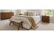 Elegantly furnished bedroom with a plush bed, wooden dresser, and stylish decor accents at 69 Red Bluff St, Summerville, SC 29483