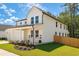 Charming two-story home with white siding, covered porch, manicured landscaping, and attached garage at 69 Red Bluff St, Summerville, SC 29483