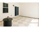 Cozy covered patio with checkerboard floors, sliding glass doors, and outdoor lighting at 69 Red Bluff St, Summerville, SC 29483