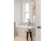 Relaxing soaking tub in a modern bathroom with elegant fixtures and a bright window view at 7053 Schooner St, Daniel Island, SC 29492