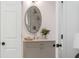 Bathroom featuring a marble vanity, elegant fixtures, and decorative plants at 7053 Schooner St, Daniel Island, SC 29492