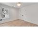 Well-lit bedroom features a window, closet, hardwood floors, and white paint at 7053 Schooner St, Daniel Island, SC 29492