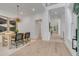 Bright, airy dining room featuring hardwood floors, modern light fixture, and an open layout at 7053 Schooner St, Daniel Island, SC 29492