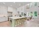 Open concept kitchen with large center island, stainless steel appliances, and modern finishes at 7053 Schooner St, Daniel Island, SC 29492