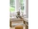 Cozy living room featuring comfortable white sofa, stylish decor, and large windows offering abundant natural light at 7053 Schooner St, Daniel Island, SC 29492