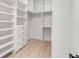 Organized walk-in closet with custom shelving and ample storage for clothes and accessories at 7053 Schooner St, Daniel Island, SC 29492