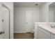 Modern bathroom boasts a walk-in shower, wood-look floors, and white vanity at 758 Meadowbrook Lane, Summerville, SC 29486