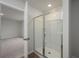 Bathroom featuring a glass enclosed walk-in shower and wood-look floors at 758 Meadowbrook Lane, Summerville, SC 29486