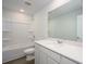 Bright bathroom featuring a tub/shower, and white vanity with a sink and large mirror at 758 Meadowbrook Lane, Summerville, SC 29486
