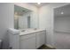 Bathroom features a dual sink vanity with modern fixtures and a large mirror at 758 Meadowbrook Lane, Summerville, SC 29486