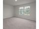 Bedroom with plush neutral carpeting and a picturesque window view at 758 Meadowbrook Lane, Summerville, SC 29486