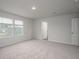 Bright bedroom features neutral walls, carpet, and multiple windows allowing for ample natural light at 758 Meadowbrook Lane, Summerville, SC 29486