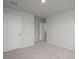 Spacious bedroom showcasing neutral walls, plush carpeting, and convenient interior door access at 758 Meadowbrook Lane, Summerville, SC 29486