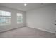 Inviting bedroom featuring dual windows, neutral walls, and a view of the neighborhood at 758 Meadowbrook Lane, Summerville, SC 29486