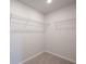 Walk-in closet provides great storage with wire shelving and plush carpet at 758 Meadowbrook Lane, Summerville, SC 29486