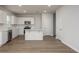 Modern kitchen featuring white cabinets, stainless steel appliances, and a central island with a quartz countertop at 758 Meadowbrook Lane, Summerville, SC 29486