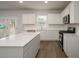 Bright kitchen features white cabinets, stainless steel appliances, and a large center island at 758 Meadowbrook Lane, Summerville, SC 29486