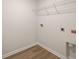 Small laundry room featuring luxury vinyl plank flooring and a wire rack at 758 Meadowbrook Lane, Summerville, SC 29486