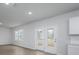 This open living area offers an exit to the exterior through double glass doors at 758 Meadowbrook Lane, Summerville, SC 29486
