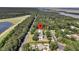 Aerial view of home with mature trees and near the coast at 7878 Gull Bay Dr, Awendaw, SC 29429
