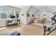Versatile bonus room with natural light, a desk area, and comfortable seating arrangements at 7878 Gull Bay Dr, Awendaw, SC 29429